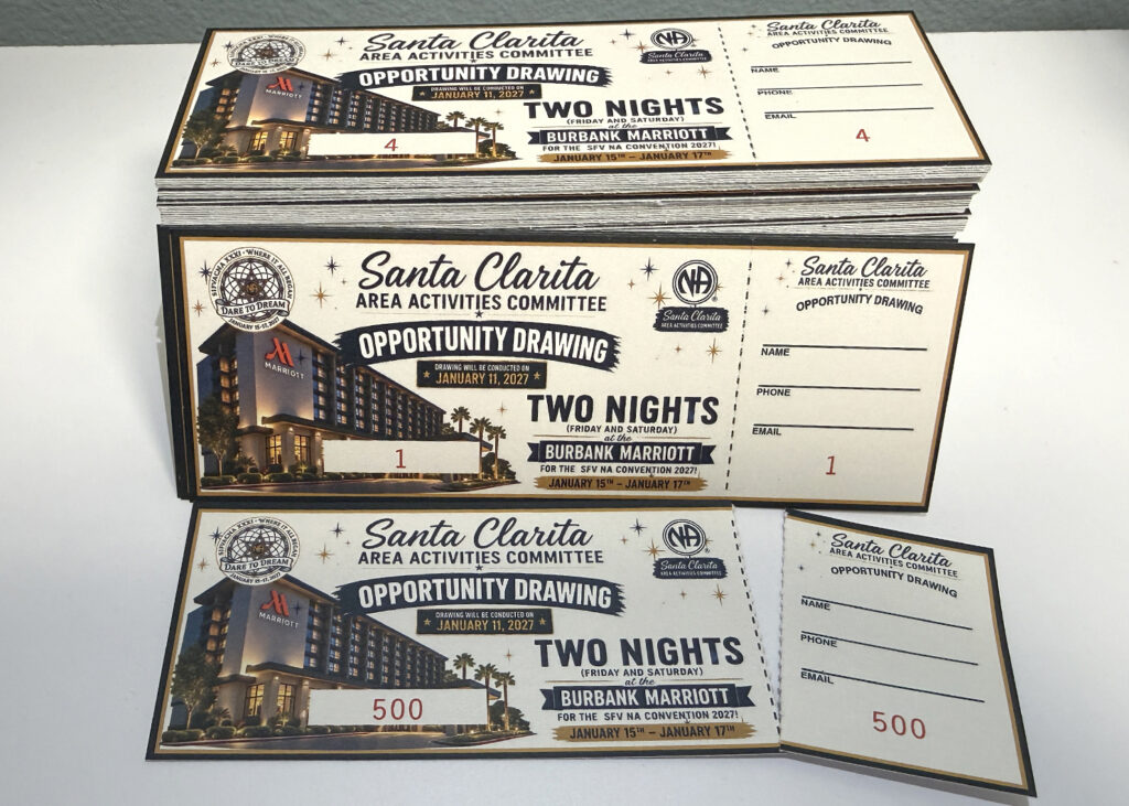 Stack of custom numbered event tickets with perforated tear-off stubs